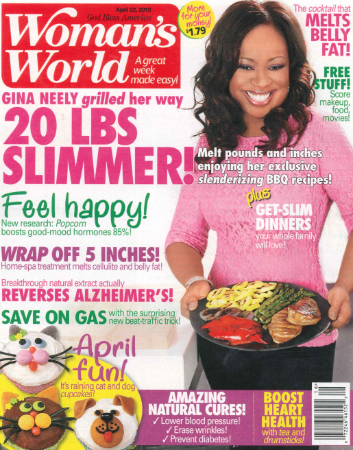 Front cover of Woman's World magazine featuring a smiling woman in a pink top holding a plate of grilled chicken, with large promotional headlines and colorful design elements across the cover.