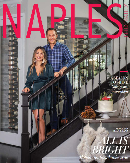 Magazine cover featuring a man and woman standing on a staircase with 'Naples Illustrated' branding.