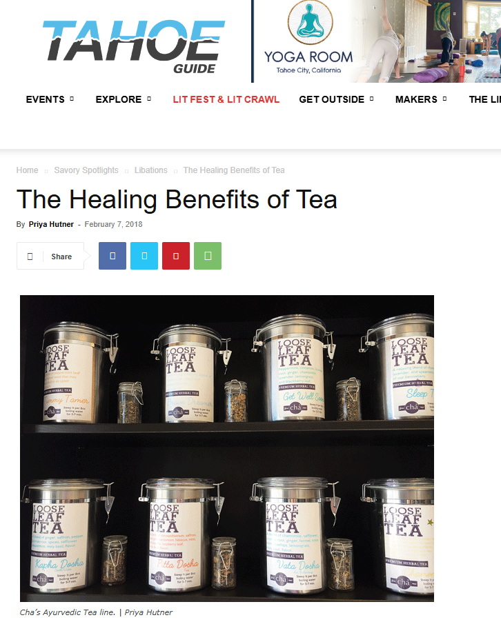 Tea canisters on a shelf with 'Tahoe Guide' and 'Yoga Room' branding.