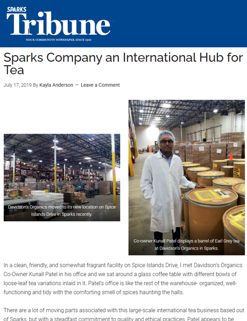Newspaper article about a tea company in Sparks, featuring warehouse images and a person in a lab coat.