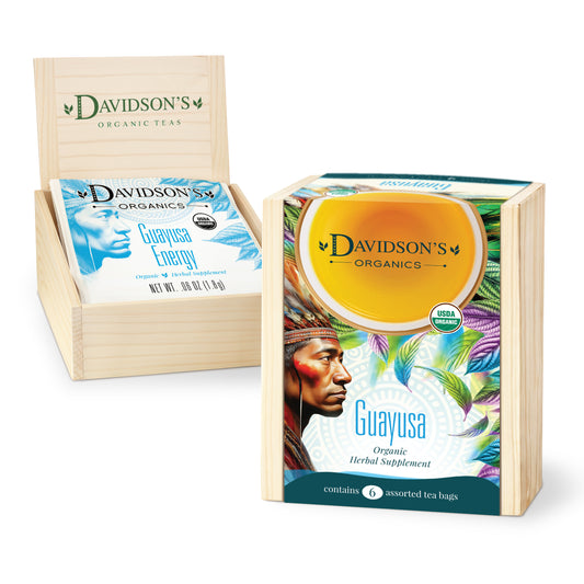 Davidson's Organics Guayusa tea packaging with a wooden display stand on a white background