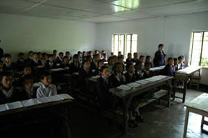 Children learning in a classroom at a local school.